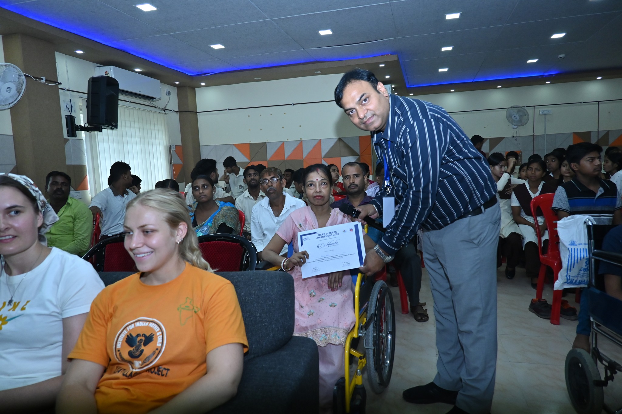 A researcher presenting their findings on a large screen.